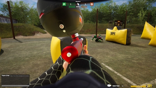 Player performing a running slide during a paintball match in SPLASH – Paintball